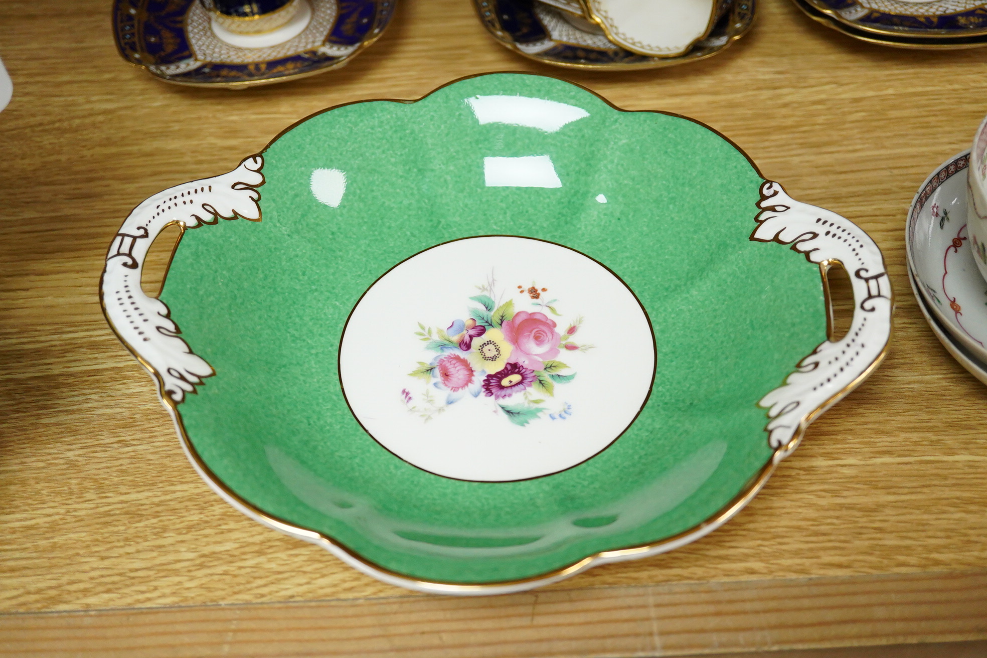 A collection of Coalport porcelain to include cups and saucers, a Meissen Pony, Meissen blue and white plate and a 19th century desk stand, largest 25cm wide